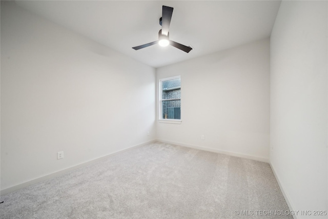 spare room featuring carpet floors and ceiling fan