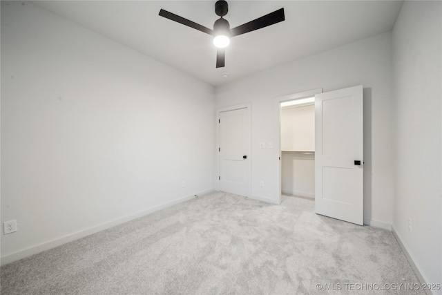 unfurnished bedroom with light carpet and ceiling fan