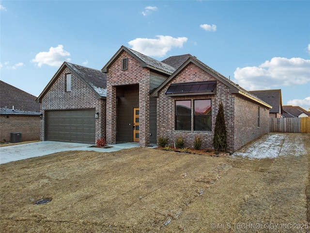 view of front of property featuring a garage and a front yard