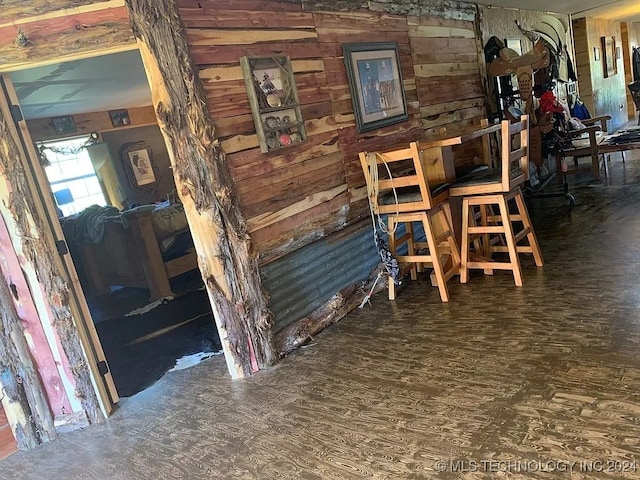 dining room with wood walls