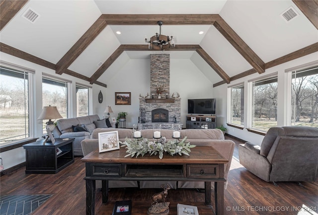 living room with a fireplace, dark hardwood / wood-style flooring, an inviting chandelier, and high vaulted ceiling