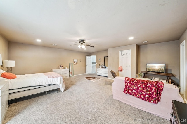 carpeted bedroom featuring ceiling fan