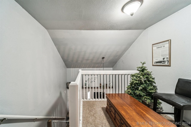 sitting room with light colored carpet and lofted ceiling