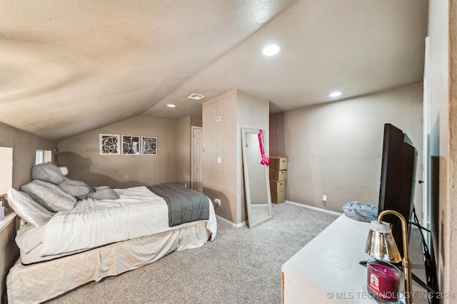 bedroom featuring carpet flooring and lofted ceiling