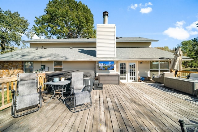 deck with outdoor lounge area and french doors