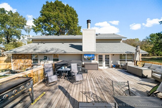 deck with an outdoor hangout area and french doors