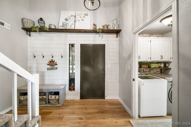 mudroom with washer / dryer and light hardwood / wood-style flooring