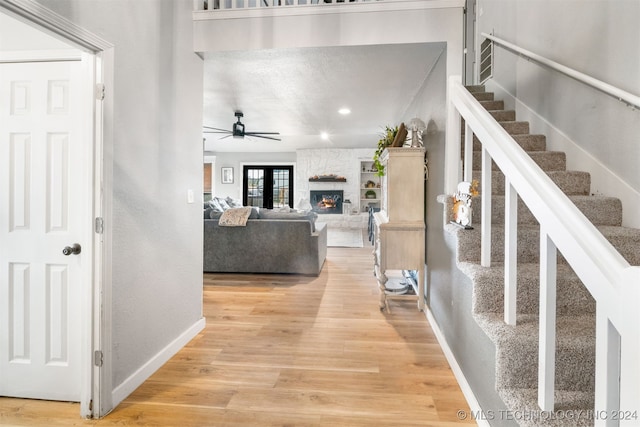 hall with hardwood / wood-style flooring