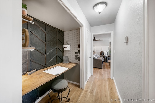 bathroom featuring ceiling fan and wood-type flooring