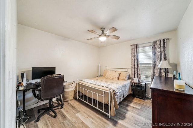 bedroom featuring light hardwood / wood-style flooring and ceiling fan