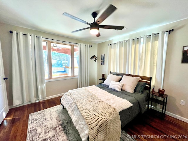 bedroom featuring dark hardwood / wood-style flooring and ceiling fan