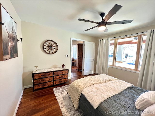 bedroom featuring ceiling fan and dark hardwood / wood-style flooring