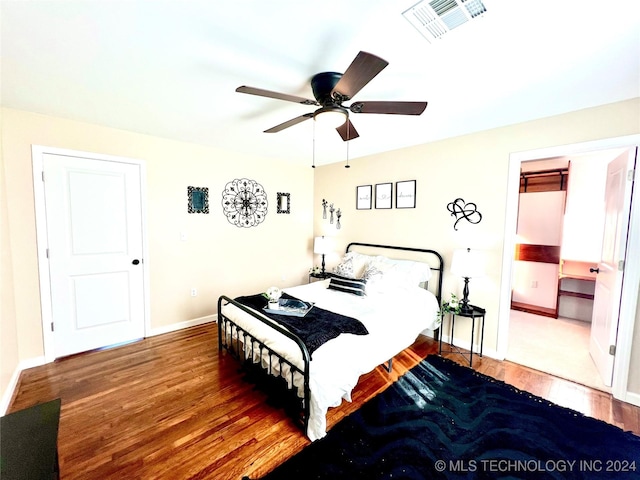 bedroom with ceiling fan and wood-type flooring