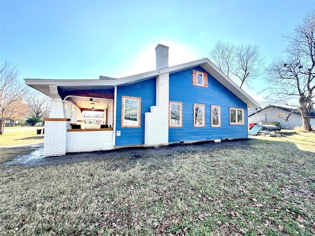 view of home's exterior with a yard