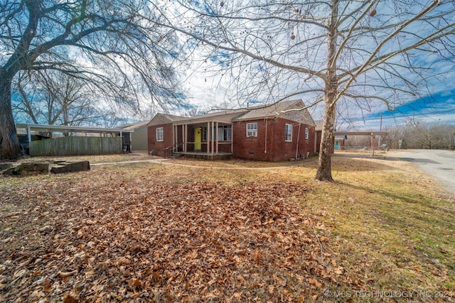 rear view of house featuring a yard