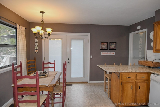 dining space with a chandelier