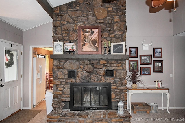 details with white refrigerator with ice dispenser, carpet floors, and a stone fireplace