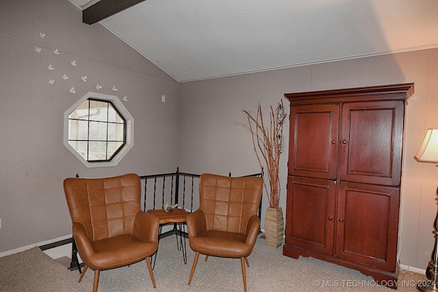 living area with lofted ceiling with beams and light carpet