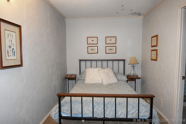 carpeted bedroom with ornamental molding