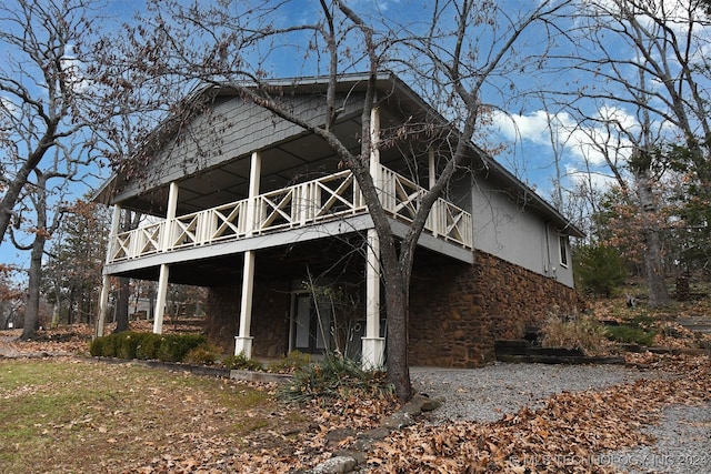 view of property exterior with a balcony