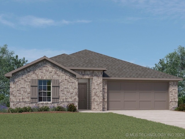 view of front of house featuring a front yard and a garage