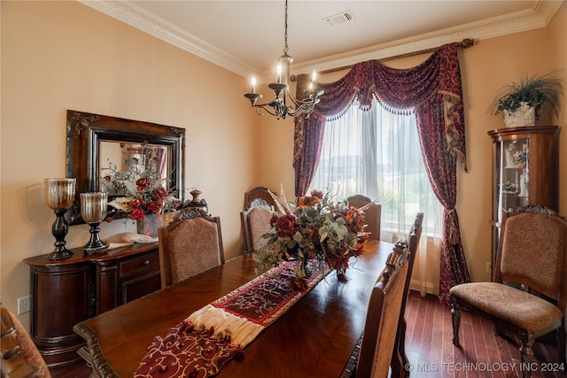 dining area with a chandelier, hardwood / wood-style floors, and ornamental molding