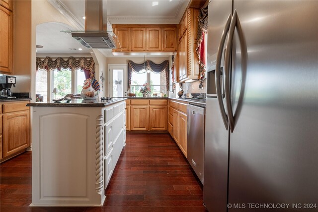 kitchen featuring a center island, wall chimney exhaust hood, dark hardwood / wood-style floors, crown molding, and appliances with stainless steel finishes