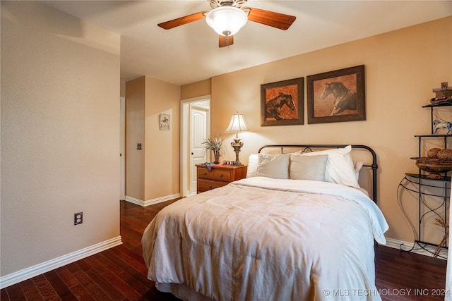 bedroom featuring ceiling fan and dark hardwood / wood-style flooring