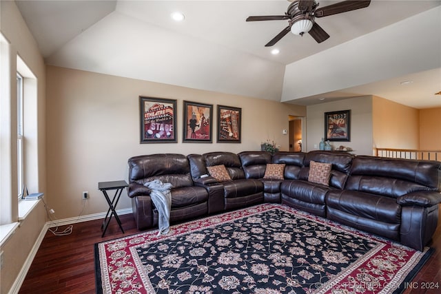 living room with dark hardwood / wood-style floors, ceiling fan, and vaulted ceiling