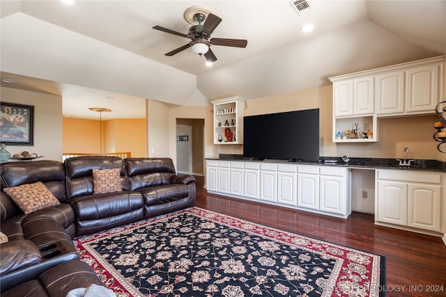 living room with dark hardwood / wood-style floors, ceiling fan, lofted ceiling, and sink