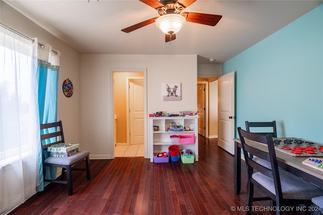 home office featuring ceiling fan and dark hardwood / wood-style flooring