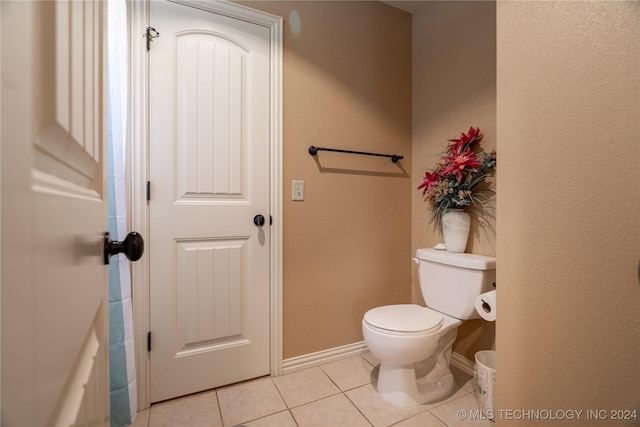 bathroom featuring tile patterned floors and toilet