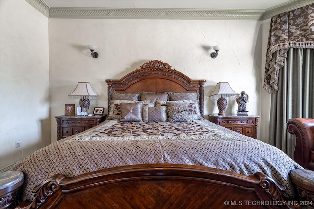 bedroom with ornamental molding