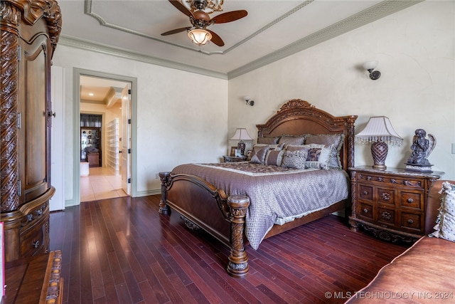 bedroom featuring ceiling fan, hardwood / wood-style floors, and ornamental molding