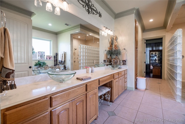 bathroom featuring tile patterned floors, vanity, and crown molding