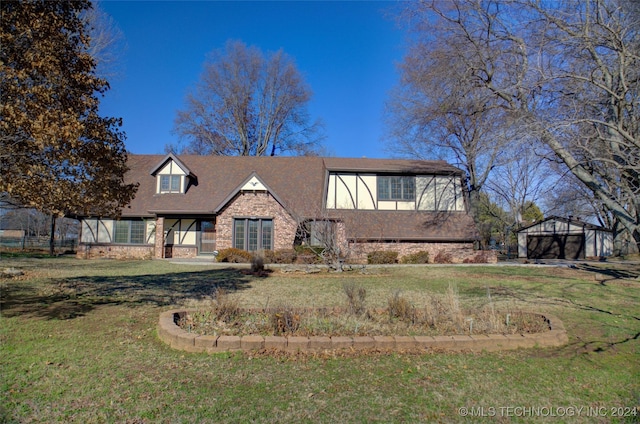 tudor home with a front yard