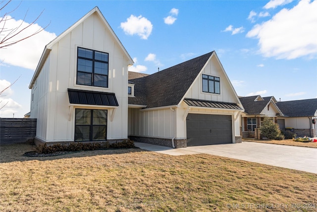 modern farmhouse style home featuring a front yard