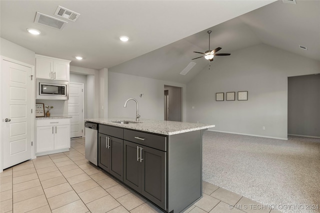 kitchen featuring ceiling fan, white cabinetry, sink, an island with sink, and appliances with stainless steel finishes