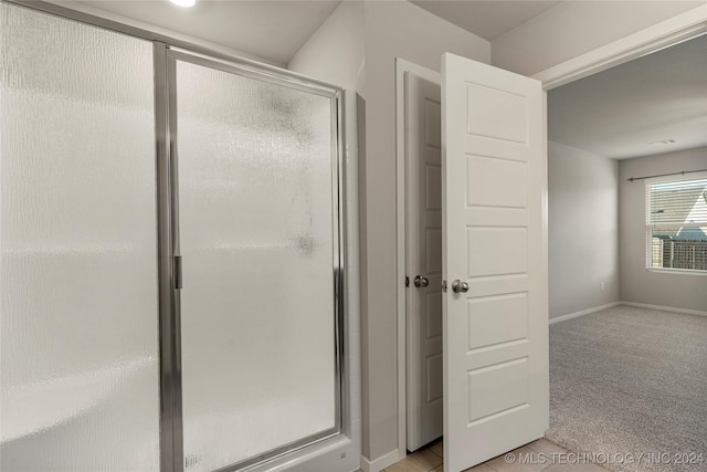 bathroom featuring walk in shower