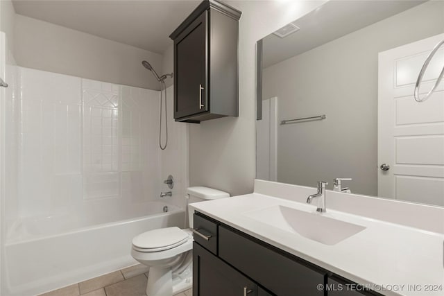 full bathroom with toilet, vanity, tile patterned floors, and tub / shower combination