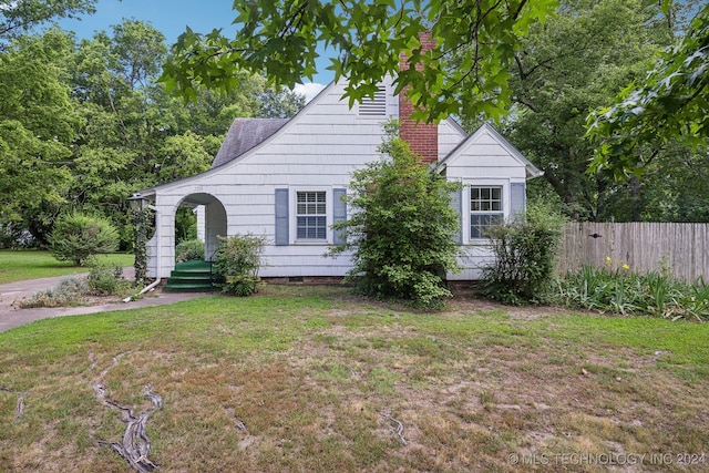 view of front of home with a front yard