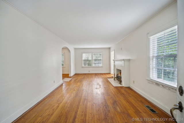 unfurnished living room featuring light hardwood / wood-style flooring