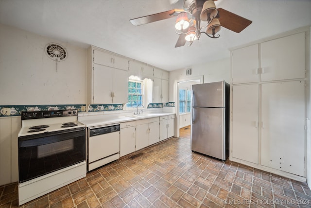 kitchen with white cabinets, white appliances, ceiling fan, and sink