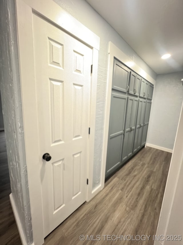 hall featuring dark wood-type flooring