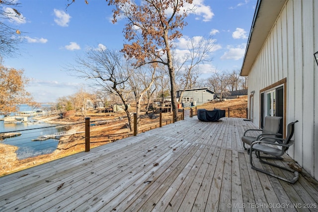 wooden deck with a water view