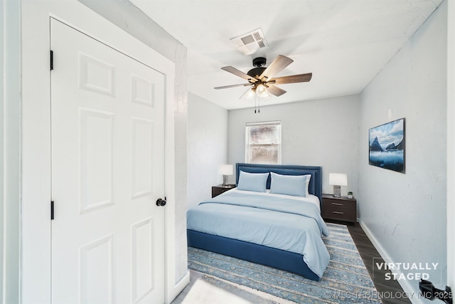 bedroom featuring hardwood / wood-style flooring and ceiling fan