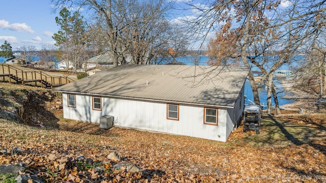 rear view of house with cooling unit