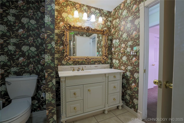 bathroom with tile patterned floors, vanity, and toilet