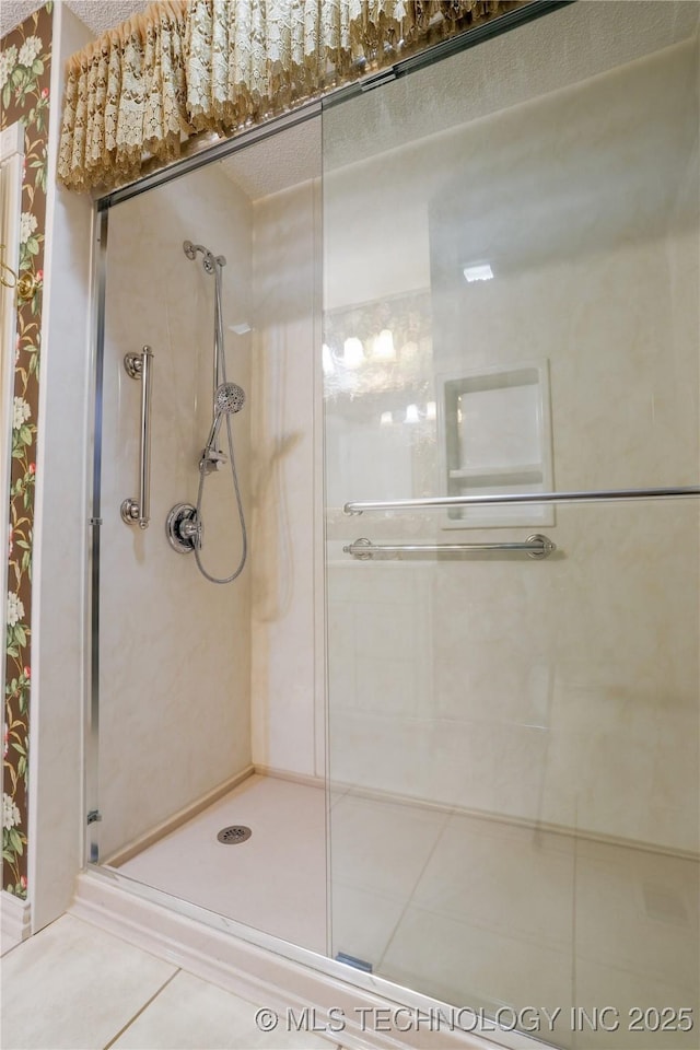 bathroom featuring tile patterned flooring and walk in shower