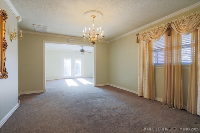 carpeted spare room with french doors, ceiling fan with notable chandelier, a textured ceiling, and ornamental molding